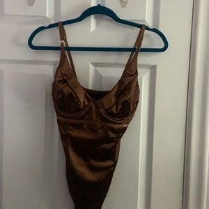 Brown women’s V neck shiny bodysuit tank top with underwire.